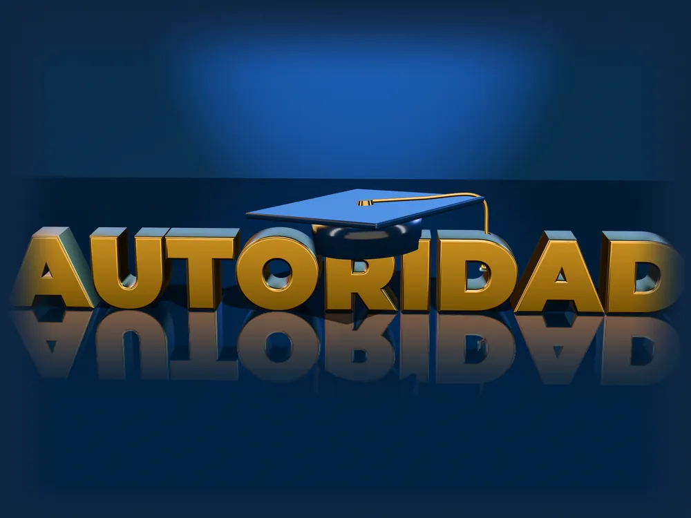 Birrete de graduación sobre la palabra AUTORIDAD en letras doradas en 3D